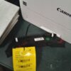 A black and red tag is on the side of a box.