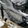 A car that has been smashed in the back of it.