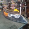 A car headlight sitting on top of a table.