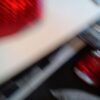 A blurry picture of red lights and a white table.