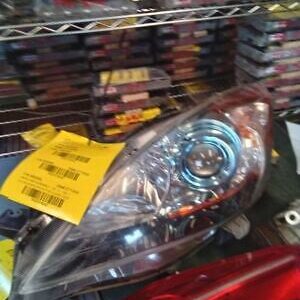 A car headlight with stickers on it