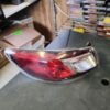 A car 's tail light is on the floor.