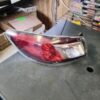 A car 's tail light is on the floor.