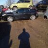 A person standing in front of some cars