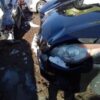 A blue motorcycle is shown in the mud.