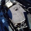 A car engine with the lid open.