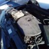 A car engine with the hood open.