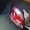 A car 's tail light is shown on the floor.