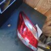 A red and white tail light sitting on top of a table.