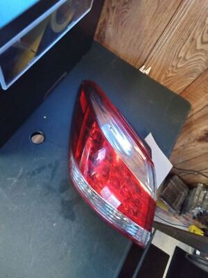 A red and white tail light sitting on top of a table.