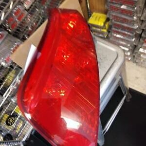 A red tail light sitting on top of a table.