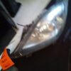 A close up of the headlight on a car