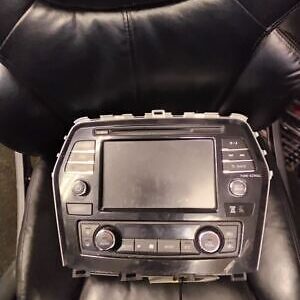 A black leather chair with a car radio on it