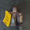 A motor is sitting on the floor with a price tag.