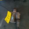 A broken drill with a yellow tag on it.