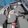 A car that is broken down and has been stripped of it.
