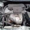 A car engine with the hood open.