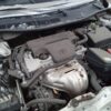 A car engine with the hood open.