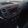 A car dashboard with the radio and other items on it.