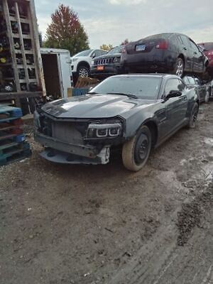 A car that is sitting in the dirt.