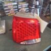 A red and white car tail light on top of a table.