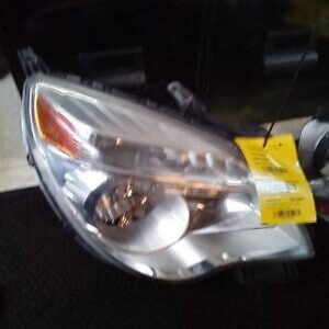 A car headlight with the bulb on it.