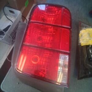 A red tail light sitting on top of a table.