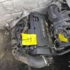 A car engine sitting in the middle of a street.