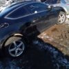 A car that has been smashed in the snow.