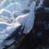 A boat is covered in snow and ice.