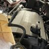 A car engine with some cardboard on top of it