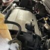 A car engine with some snow on top of it