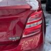 A red car with the word " z 5 7 5 1 0 " written on it.