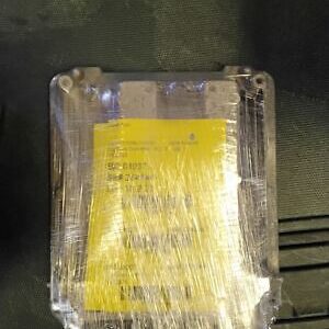 A box of yellow tape is wrapped in plastic.