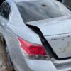 A car that has been smashed in the back of it.