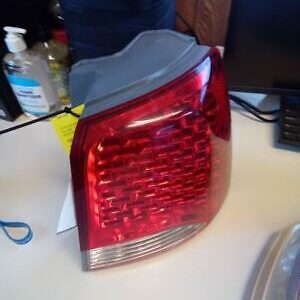 A red tail light sitting on top of a table.