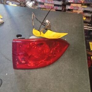 A red tail light sitting on top of a table.