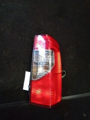 A red and white light on the side of a car.