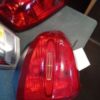 A red tail light sitting on top of a table.