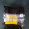 A black box with yellow sticker on it