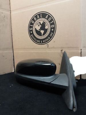 A box with a mirror and a sign on it