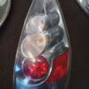 A bottle of batteries and some red light bulbs