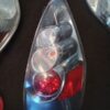 A close up of a car light with batteries in it