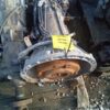 A car engine with a yellow tag on it.