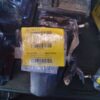 A close up of some parts with a tag on them