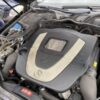 A car engine with the hood open.