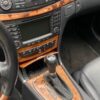 A car 's interior is shown with wood trim.