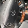 A close up of the steering wheel on a car