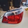A red and white car tail light on top of a table.