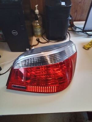 A red and white car tail light on top of a table.